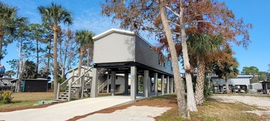 Welcome to effortless waterfront living in the peaceful, golf - photo 3