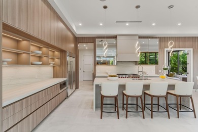 This extraordinary two-story estate is purpose-built for those