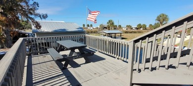 Welcome to effortless waterfront living in the peaceful, golf - photo 7