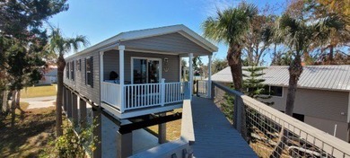 Welcome to effortless waterfront living in the peaceful, golf - photo 10