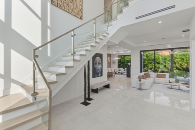 This extraordinary two-story estate is purpose-built for those