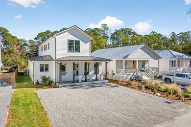 Discover the epitome of coastal luxury at 305 Elm St. in the - photo 1