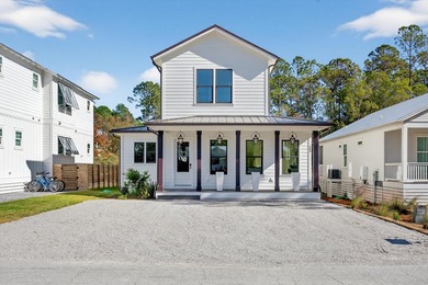 Discover the epitome of coastal luxury at 305 Elm St. in the - photo 2