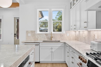 Discover the epitome of coastal luxury at 305 Elm St. in the - photo 9