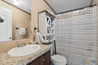 Canal-front turnkey coastal retreat with private fishing dock - photo 12