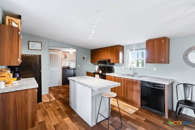 Canal-front turnkey coastal retreat with private fishing dock - photo 18
