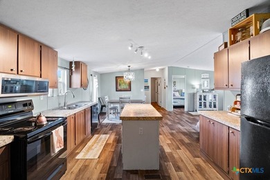 Canal-front turnkey coastal retreat with private fishing dock - photo 19