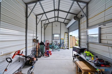Canal-front turnkey coastal retreat with private fishing dock - photo 22