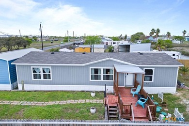 Canal-front turnkey coastal retreat with private fishing dock - photo 24