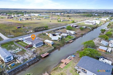 Canal-front turnkey coastal retreat with private fishing dock - photo 25