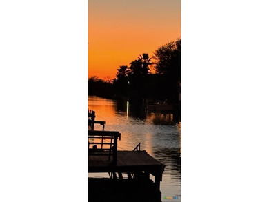 Canal-front turnkey coastal retreat with private fishing dock - photo 29