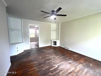 This charming three-bedroom ranch offers incredible potential - photo 3