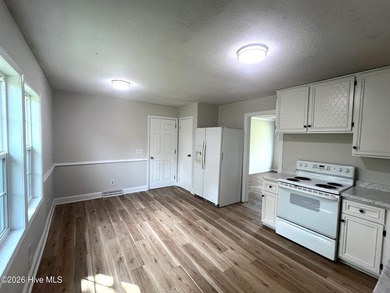 This charming three-bedroom ranch offers incredible potential - photo 6