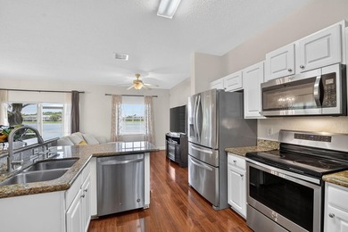 Welcome to this WATERFRONT END UNIT TOWNHOME in Emerald Lakes of - photo 16