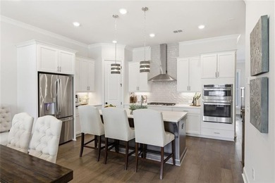 Elevated Living in Gated Waterside | Rare 3-Story Townhome with - photo 13