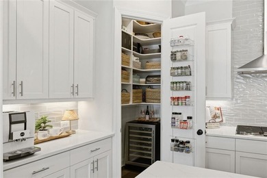 Elevated Living in Gated Waterside | Rare 3-Story Townhome with - photo 16