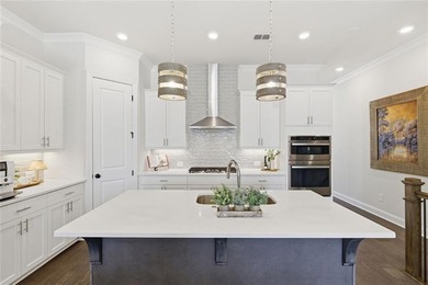 Elevated Living in Gated Waterside | Rare 3-Story Townhome with - photo 17