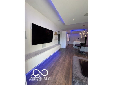 Welcome to a luxury smart home condo in Downtown Indianapolis