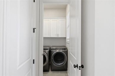 Elevated Living in Gated Waterside | Rare 3-Story Townhome with - photo 19