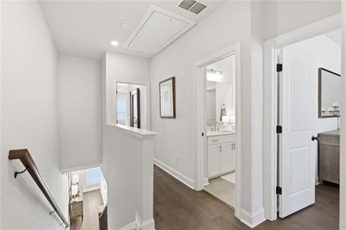 Elevated Living in Gated Waterside | Rare 3-Story Townhome with - photo 21