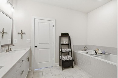 Elevated Living in Gated Waterside | Rare 3-Story Townhome with - photo 26