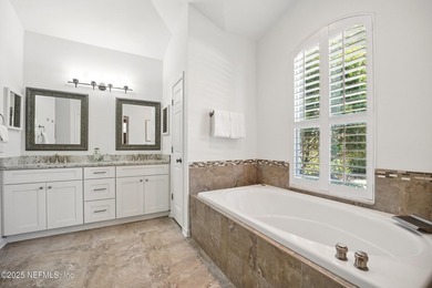 Nestled on a private 1.67-acre estate across from the - photo 29