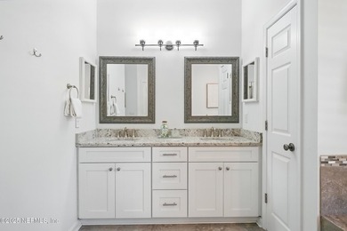 Nestled on a private 1.67-acre estate across from the - photo 30