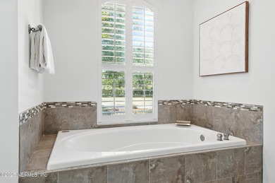 Nestled on a private 1.67-acre estate across from the - photo 31