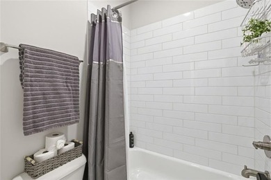 Elevated Living in Gated Waterside | Rare 3-Story Townhome with - photo 32