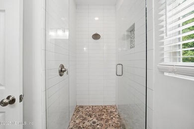 Nestled on a private 1.67-acre estate across from the - photo 36