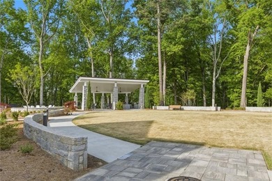 Elevated Living in Gated Waterside | Rare 3-Story Townhome with - photo 40