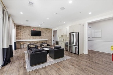Elevated Living in Gated Waterside | Rare 3-Story Townhome with - photo 44