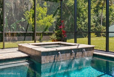 Nestled on a private 1.67-acre estate across from the - photo 54