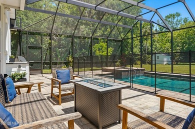 Nestled on a private 1.67-acre estate across from the - photo 59