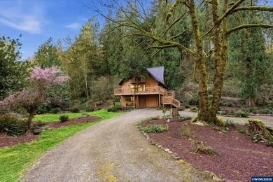 A custom chalet-style home surrounded by natural forest on - photo 19