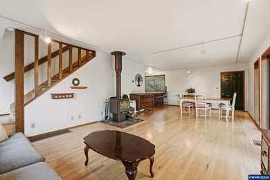 A custom chalet-style home surrounded by natural forest on - photo 28