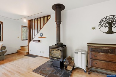 A custom chalet-style home surrounded by natural forest on - photo 29