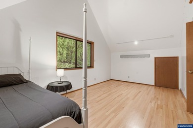 A custom chalet-style home surrounded by natural forest on - photo 33