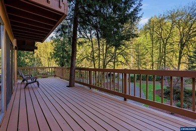 A custom chalet-style home surrounded by natural forest on - photo 36