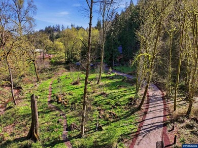 A custom chalet-style home surrounded by natural forest on - photo 42