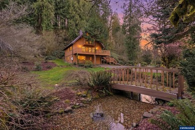 A custom chalet-style home surrounded by natural forest on - photo 44