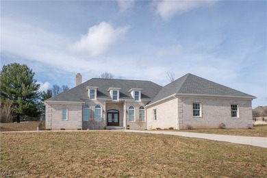 Custom-built all-brick ranch situated on a private 1.41-acre
