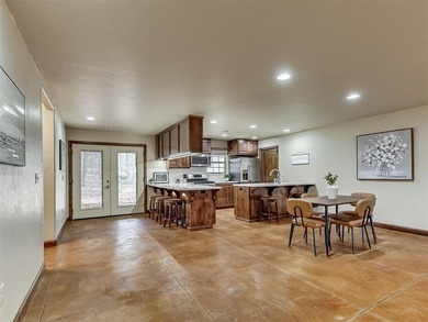 Tucked away on 5 secluded, gated acres, this beautifully crafted