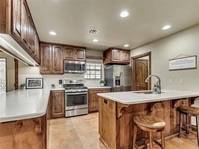 Tucked away on 5 secluded, gated acres, this beautifully crafted