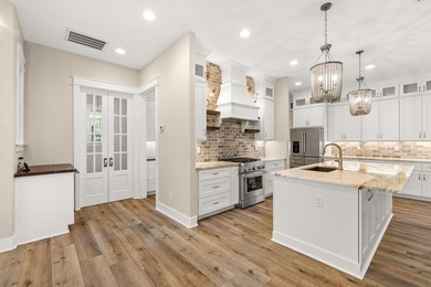 Nestled on 1.38 gated & fenced acres, this custom-built home - photo 38