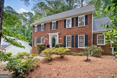 Traditional brick home on a lovely wooded lot near the best of - photo 7