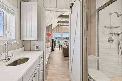 This rare, charming beachfront escape feels like you are on the - photo 14