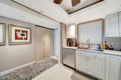 Live the coastal lifestyle in this updated 2BR/2BA corner unit