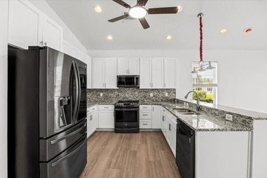 Welcome to this stunning remodeled 4-bedroom, 2.5-bathroom - photo 30
