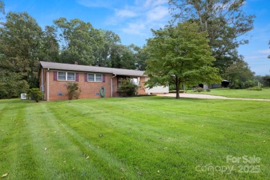 Well-maintained home on a spacious 3.28 acre corner lot in the